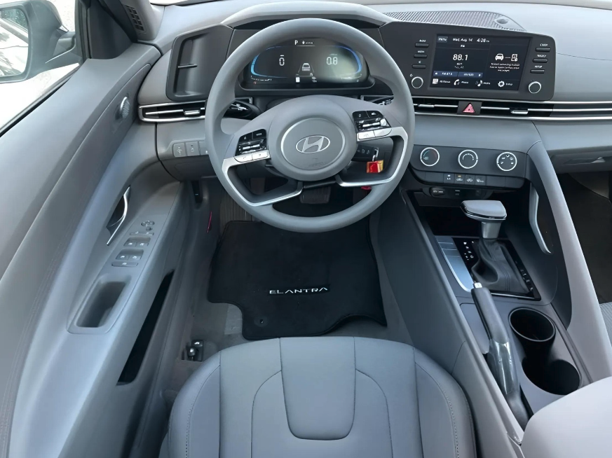 2025 Hyundai Elantra interior showcasing dashboard with digital infotainment system and steering wheel controls